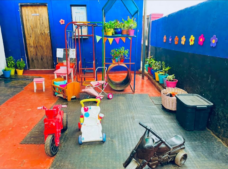 Outdoor play area with ride-on toys